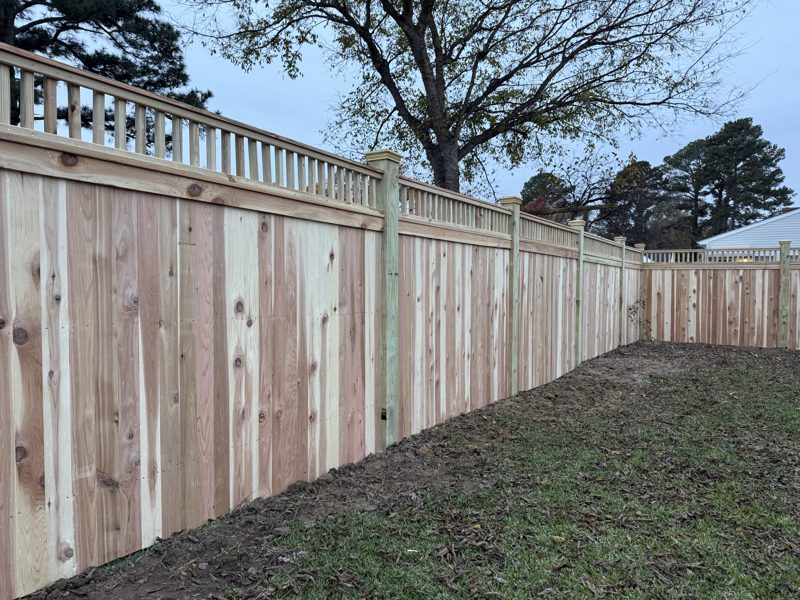 Cedar board-on-board privacy fence with a decorative lattice top